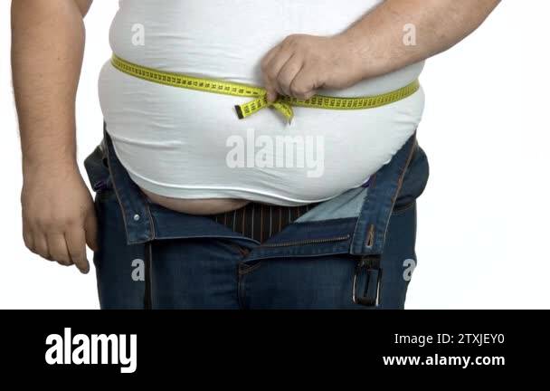 Fat man check his body with a measuring tape Stock Video Footage - Alamy