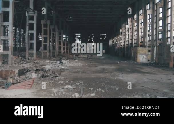 4k aerial view. Destroyed abandoned factory after the war, broken glass ...