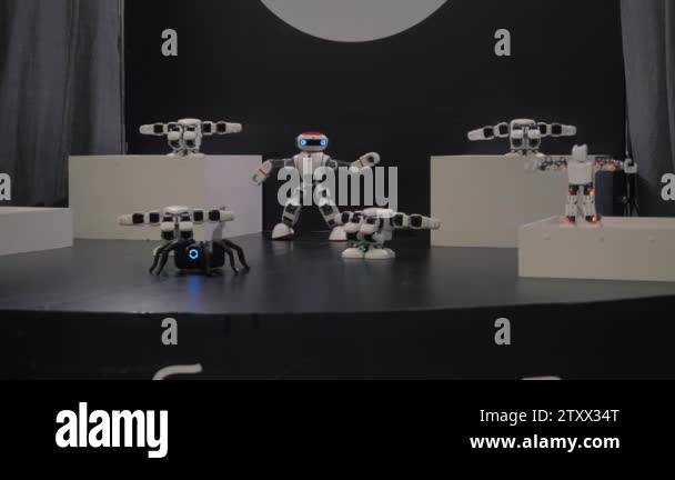 humanoid robot dance. Group of cute robots dancing. Close up of smart ...