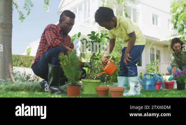 Low angle front view of an African American man and his young son in ...