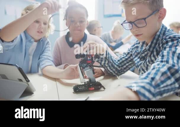 Elementary School Robotics Classroom: Diverse Group of Children ...