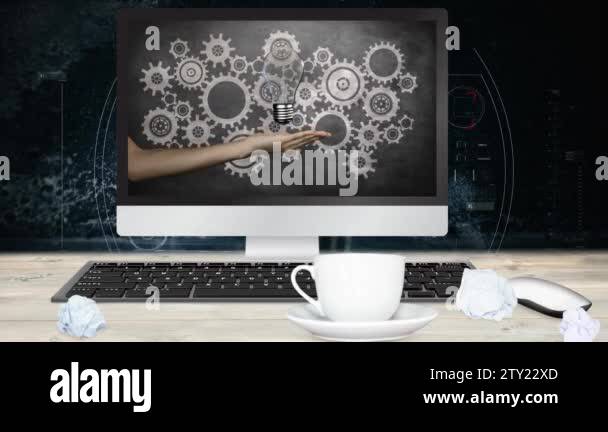 Digital Business Computer showing animated light bulb screen against ...