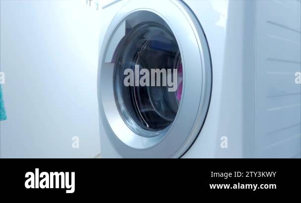 Cute Child Looks Inside the Washing Machine. Cylinder Spinning Machine ...