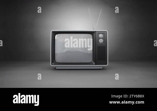Front view of an old TV switch on with animation on screen and a grey ...