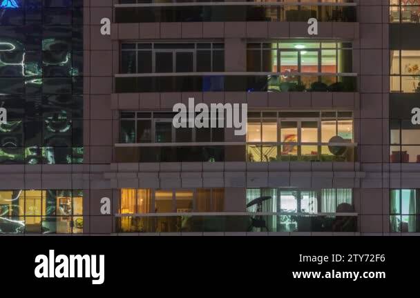 Night view of exterior apartment building timelapse. High rise ...