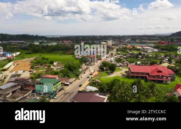 Road and streets in the town of Tacloban, Philippines. Car traffic, top ...