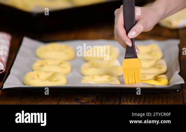 Preparation of a homemade open buns Vatrushka, fresh pastry, greases ...