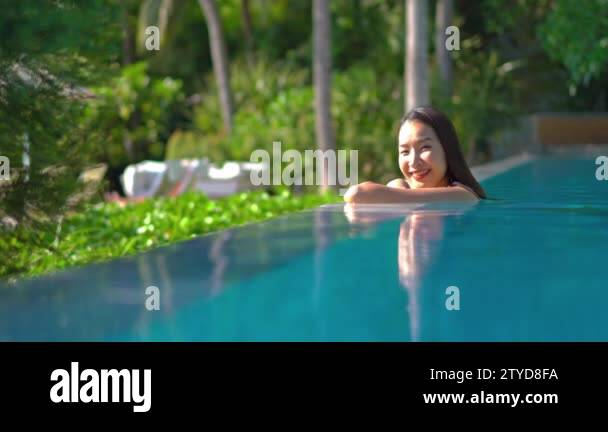 footage of woman relaxing in pool during summer vacation Stock Video ...