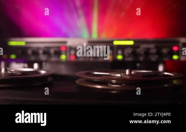 https://c8.alamy.com/comp/2tyj4p0/old-vintage-reel-to-reel-player-and-recorder-on-dark-toned-foggy-background-analog-stereo-open-reel-tape-deck-recorder-player-with-reels-2tyj4p0.jpg