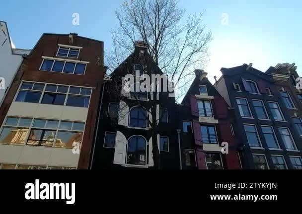 Magnificent architecture of Amsterdam houses. The houses are tilted in ...