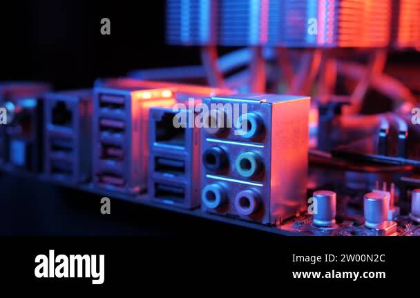 close-up of a rear motherboard panel with USB, LAN, audio connectors ...