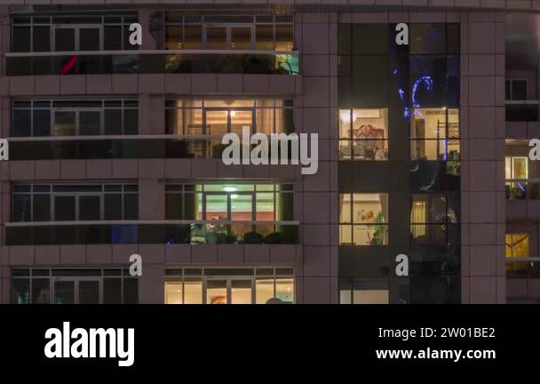 Night view of exterior apartment building timelapse. High rise ...