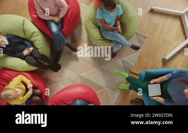 Elementary School Creativity Classroom: Children Sitting on the Bean ...