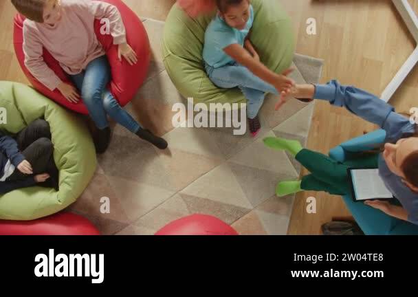 Elementary School Creativity Classroom: Children Sitting on the Bean ...