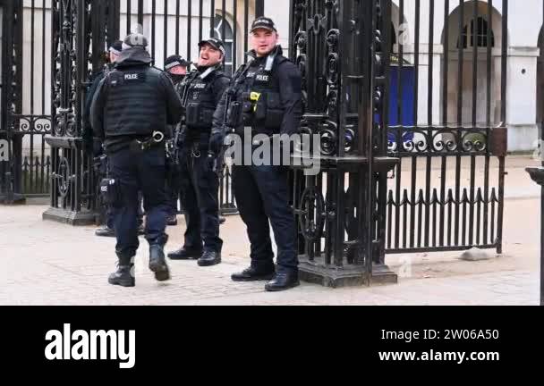 LONDON - FEBRUARY 03, 2020: Armed Police stand guard at the entrance to ...