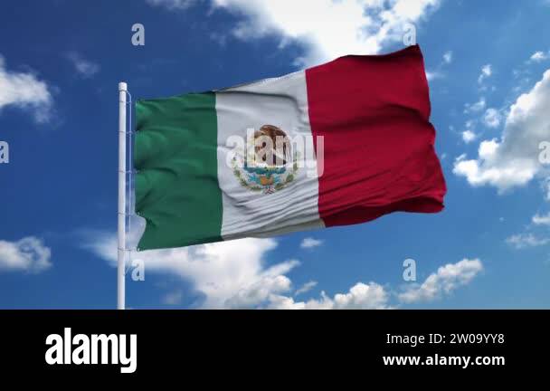 Realistic flag of Mexico waving in the wind against deep blue sky ...
