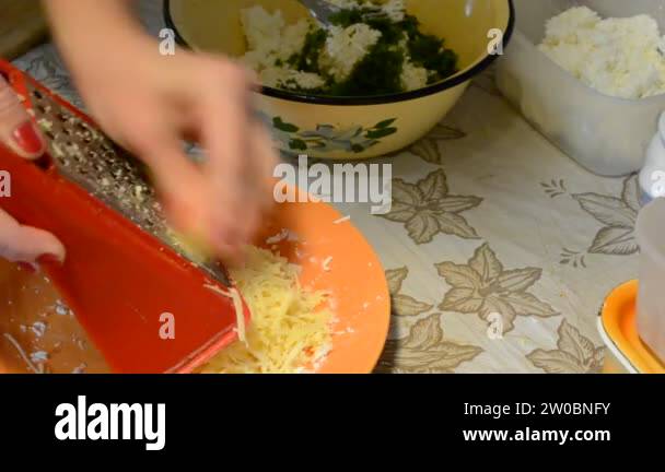 grating cheese.Cooking in kitchen Stock Video Footage - Alamy