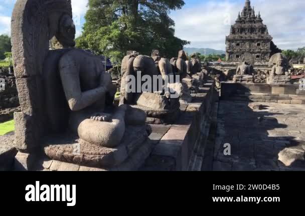Many Buddhist statues with background of Candi Plaosan or Plaosan ...