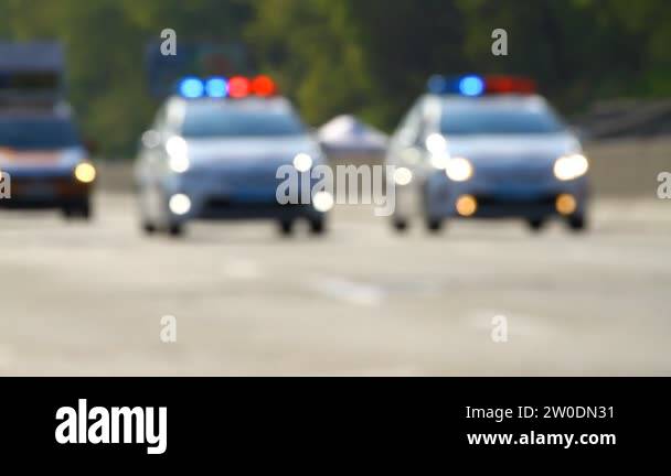 Two police cars Stock Videos & Footage - HD and 4K Video Clips - Alamy