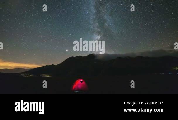 Astro Time Lapse Milky way galaxy stars over the Alps, stormy sky, fog ...
