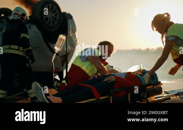 On the Car Crash Traffic Accident Scene: Paramedics Save Life of a ...