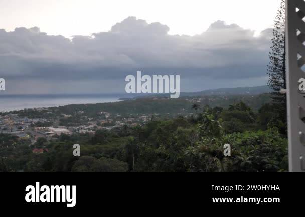 Panning view of the city of Ocho Rios from high on the hill with the ...