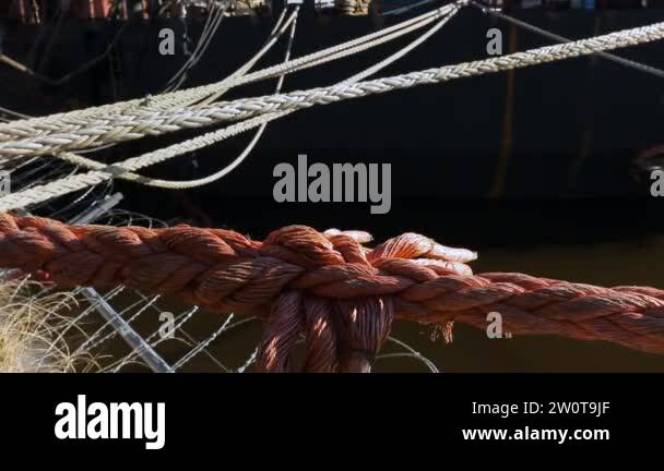 Cables used on a cargo ship. Mooring ropes.Large red and small white ...
