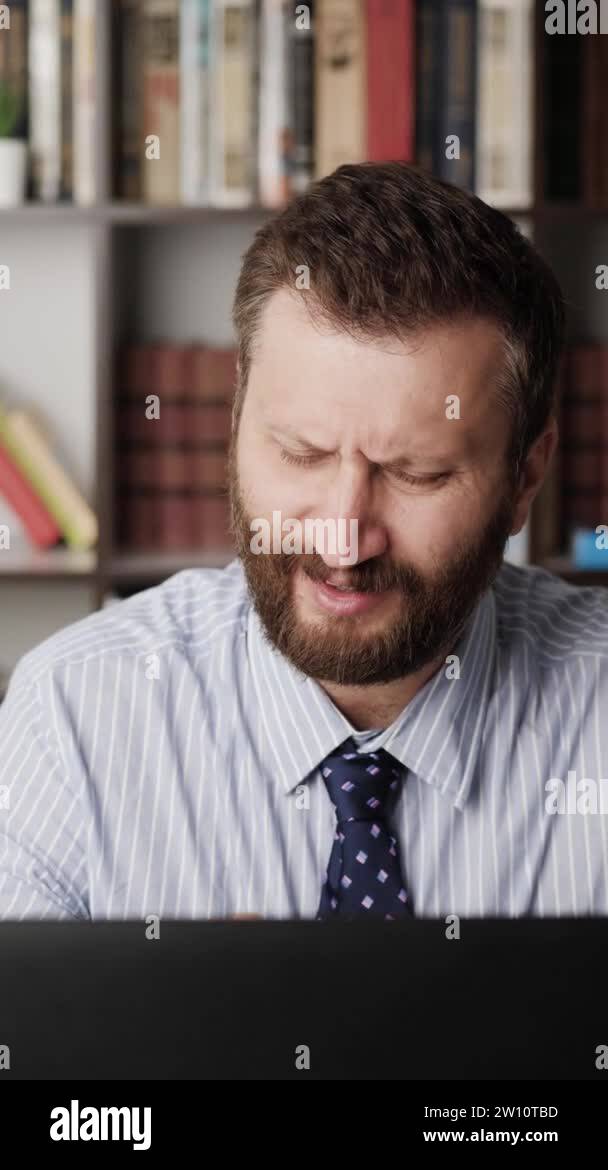 Wrist pain. Vertical orientation of man at computer working place and