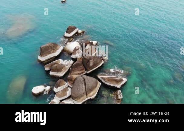 Grandmother Rocks Famous Grandfather and Grandmother Rocks located on shore of blue sea ...