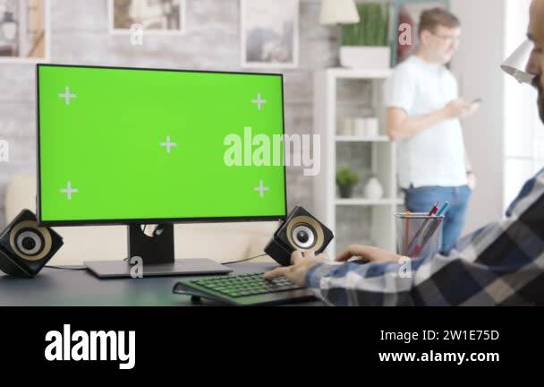 Parallax zoom in shot of man looking at green screen isolated mock-up ...