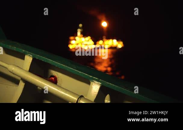 FPSO tanker vessel near Oil platform Rig at night. Offshore oil and gas ...