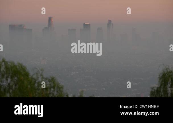 Highrise skyscrapers of metropolis in smog, Los Angeles, California USA ...