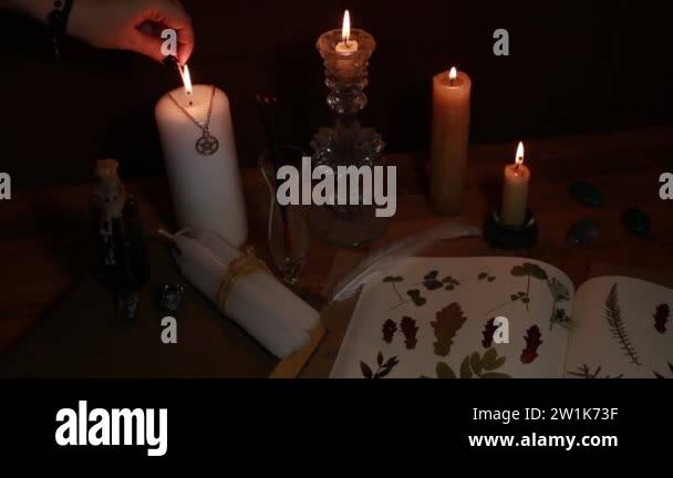 magic ritual of the alchemist with candles, runes and symbols Stock ...
