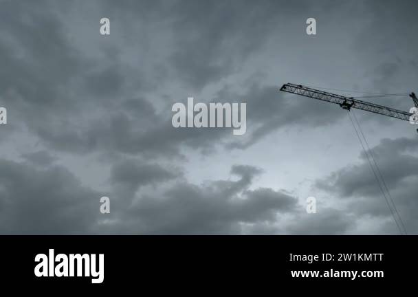 building crane boom making turn at cloudy rainy sky background Stock ...