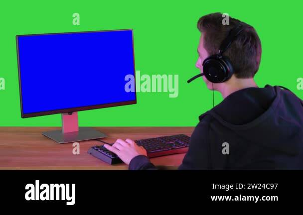 Pro Gamer Playing in Video Games on Mock-up Monitor on a Green Screen ...