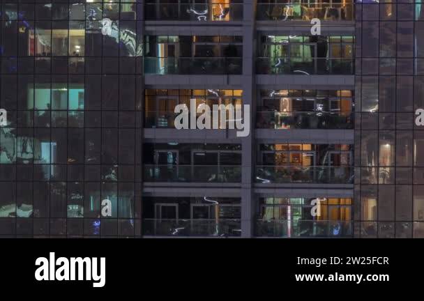 Night view of exterior apartment building timelapse. High rise ...