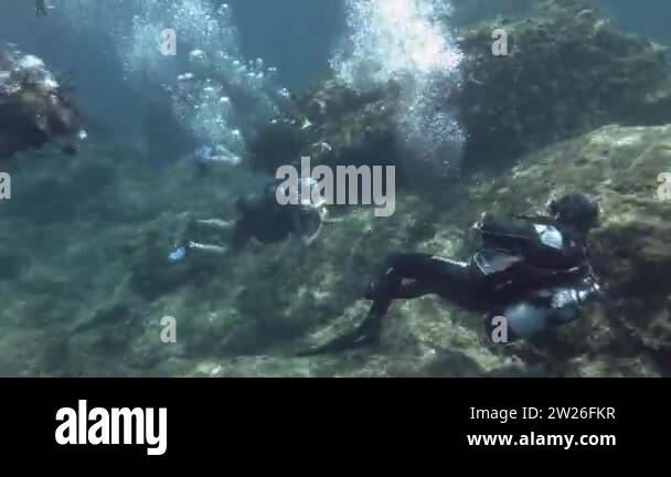 Mediterranaean Sea Greece August 2019 A Group Of Scuba Divers Swim Underwater In The First