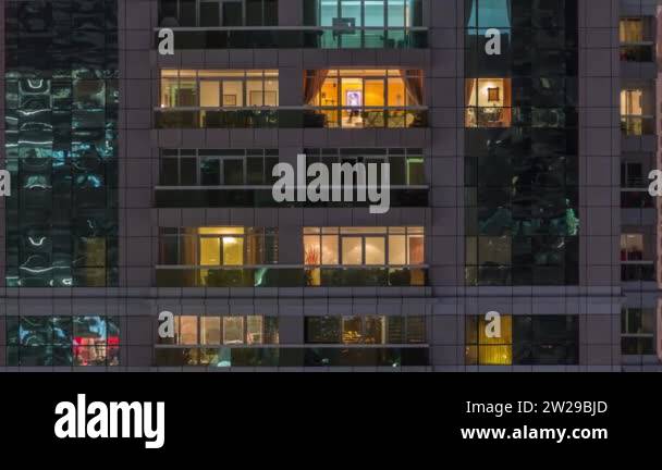 Night view of exterior apartment building timelapse. High rise ...