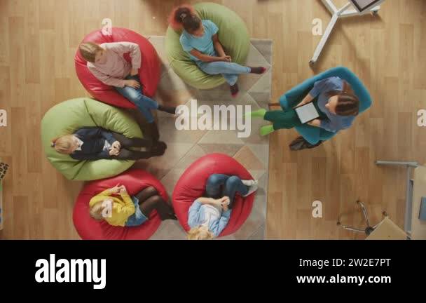 Elementary School Creativity Classroom: Children Sitting on the Bean ...