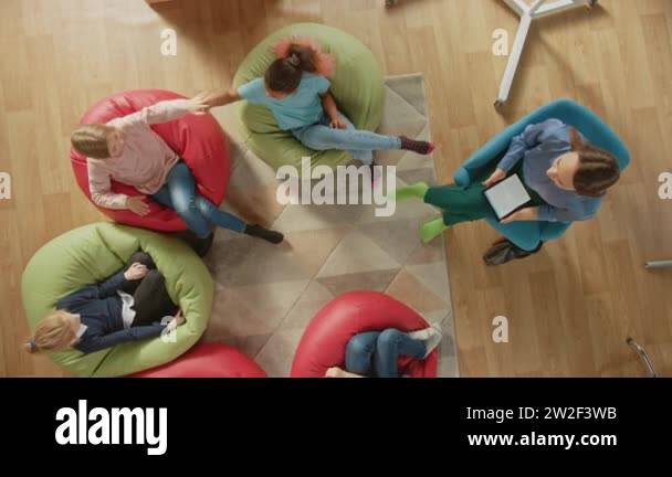 Elementary School Creativity Classroom: Children Sitting on the Bean ...
