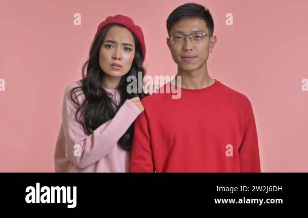 Young Asian Scared Girl Hide Herself Behind Her Boyfriend Isolated Over