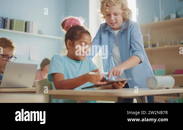 Elementary School Computer Science Class: Smart Girl Uses Digital ...