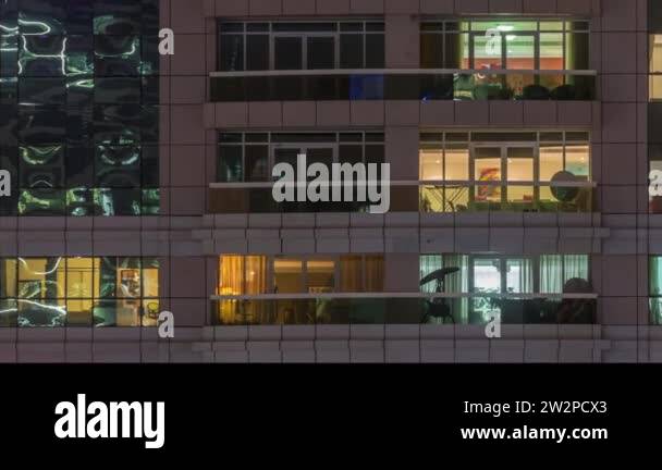 Night view of exterior apartment building timelapse. High rise ...