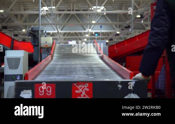 Workers on the line for sorting mail parcels, the line for sorting mail ...
