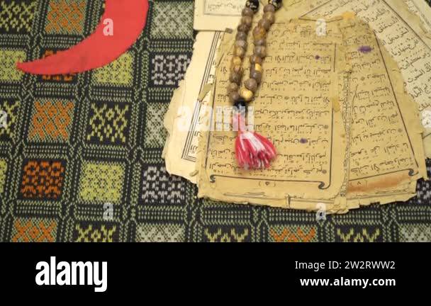 Muslim Paper Muslim prayer beads with ancient pages from the Koran. Islamic and ...