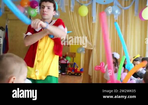 Pinocchio makes inflatable swords for children Stock Video Footage - Alamy