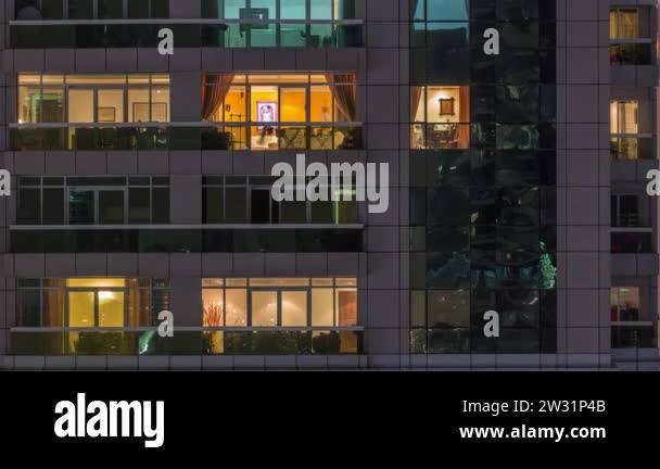 Night view of exterior apartment building timelapse. High rise ...