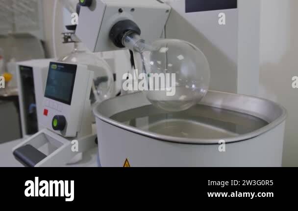 Rotating Lab Tank Rotary vacuum evaporator in chemical laboratory. Rotating flask sink ...