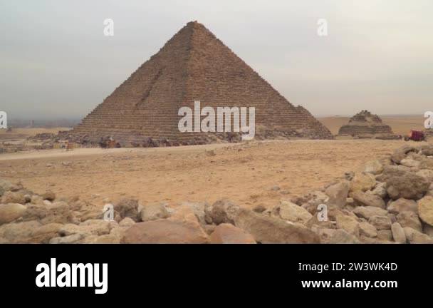 Pyramids Foot Egypt. Pyramid of Menkaure in Giza. Camels at the foot of the pyramids ...