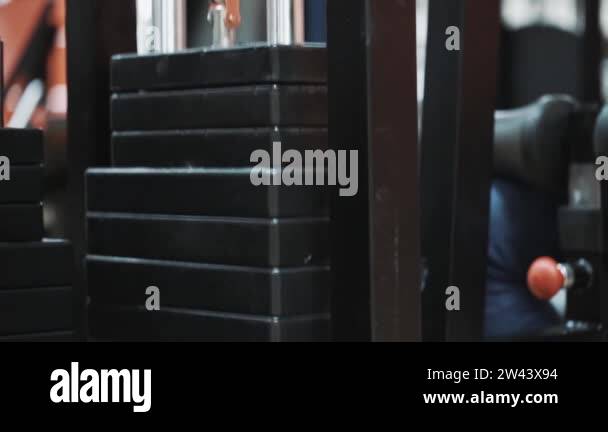 Working mechanism of weight stack in a gym trainer machine Stock Video ...